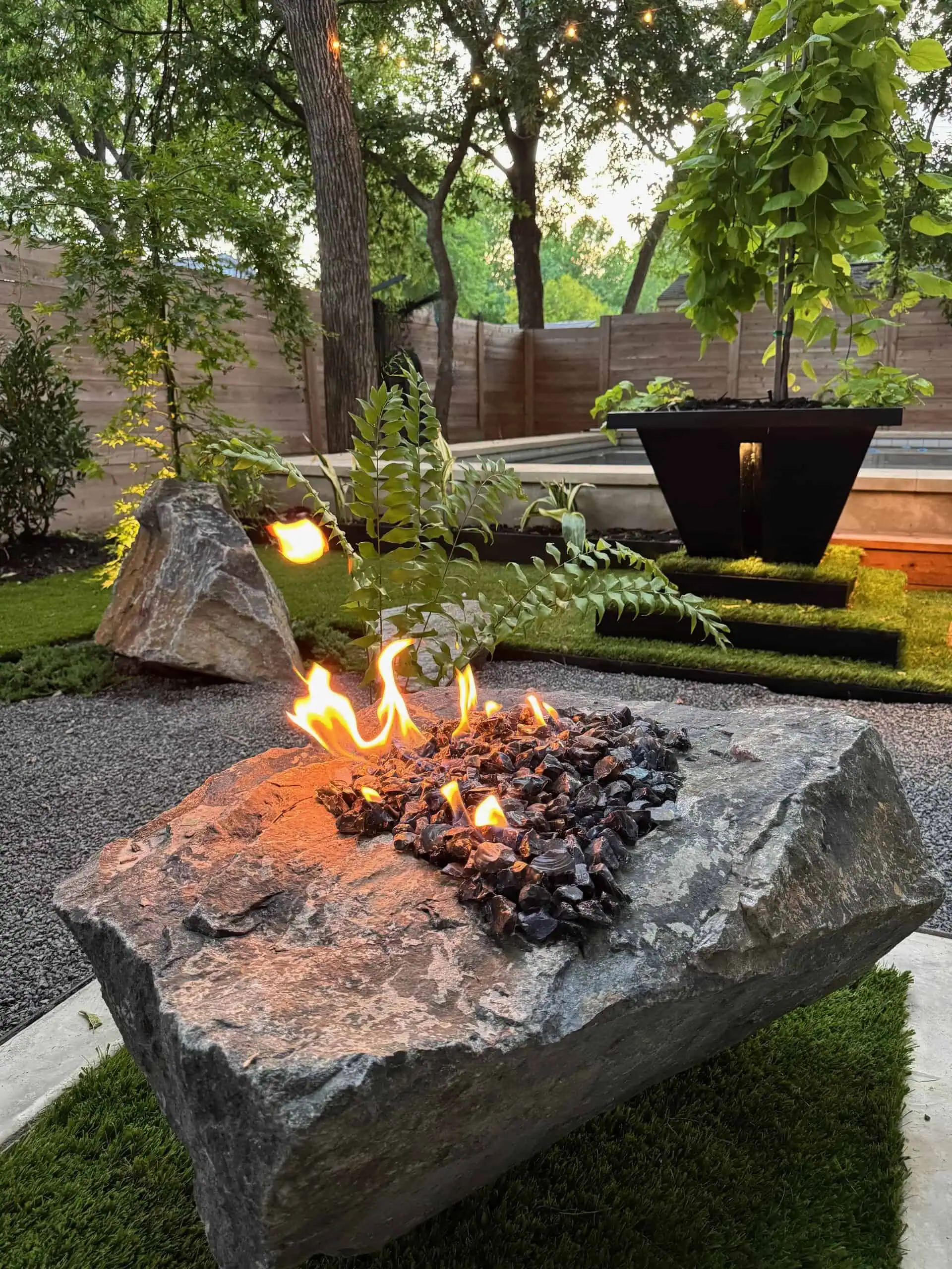 Boulder fire pit close-up with full flames — Austin TX
